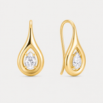 Gold teardrop-shaped earrings with clear gemstones on a light gray background